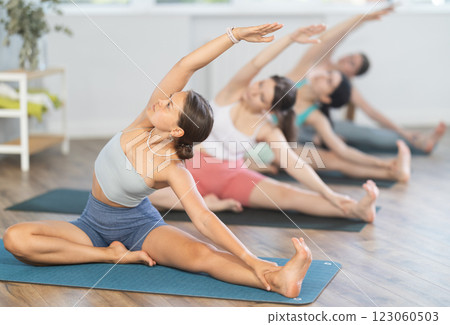 Stretching the body before yoga classes for women Stretching the body before yoga classes for women 123060503