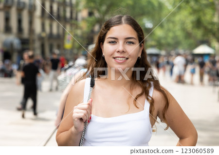 Happy young woman posing cheerfully in Rambla Street of Barcelona 123060589