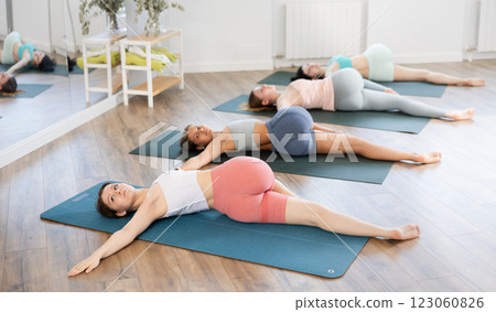 Female yoga studio and perform chatush padasana. Philosophy of active lifestyle in gym 123060826