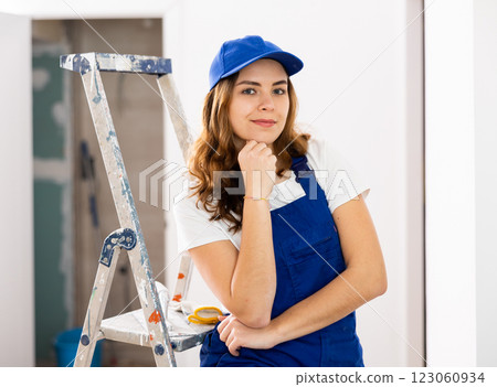Woman builder standing in apartment 123060934