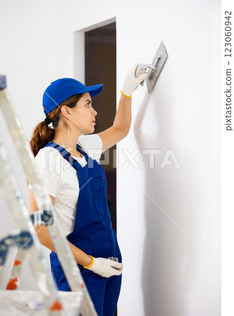 Portrait of builder in process of finishing work 123060942