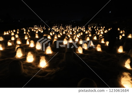 (A seasonal feature of Japan: winter night scenery) Mini snow huts at Janosakigawara <Yokote Snow Festival> 123061684