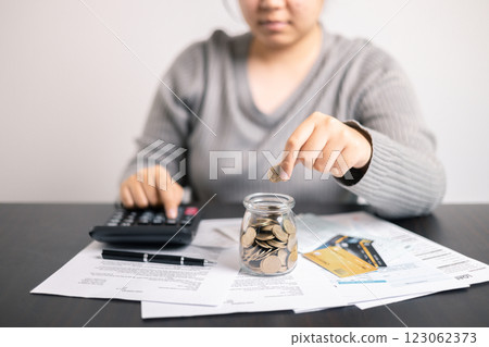 Finance bank tax expense accounting budget money businessman hand use calculator Financial calculate accountant close up calculator with graph chart write office desk Business expense analysis saving Finance bank tax expense accounting budget money businessman hand use calculator Financial calculate accountant close up calculator with graph chart write office desk Business expense analysis saving 123062373