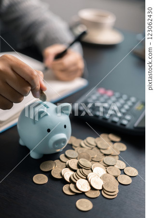 Finance bank tax expense accounting budget money businessman hand use calculator Financial calculate accountant close up calculator with graph chart write office desk Business expense analysis saving Finance bank tax expense accounting budget money businessman hand use calculator Financial calculate accountant close up calculator with graph chart write office desk Business expense analysis saving 123062430