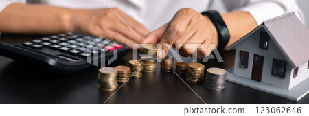 Finance bank tax expense accounting budget money businessman home for Business expense analysis saving use Financial calculate accountant close up calculator with graph chart hand write office desk 123062646