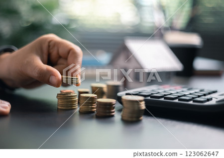 Finance bank tax expense accounting budget money businessman home for Business expense analysis saving use Financial calculate accountant close up calculator with graph chart hand write office desk 123062647