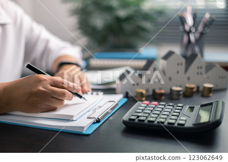 Finance bank tax expense accounting budget money businessman home for Business expense analysis saving use Financial calculate accountant close up calculator with graph chart hand write office desk Finance bank tax expense accounting budget money businessman home for Business expense analysis saving use Financial calculate accountant close up calculator with graph chart hand write office desk 123062649