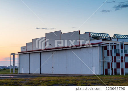 Aircraft hangar outside on an early summer morning Aircraft hangar outside on an early summer morning 123062798