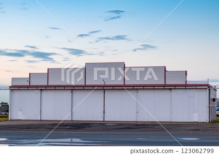 Airplane hangar outside on an early summer morning Airplane hangar outside on an early summer morning 123062799