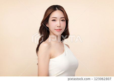 Beautiful young asian woman with clean fresh skin on beige background, Face care, Facial treatment, Cosmetology, beauty and spa, Asian women portrait. 123062807