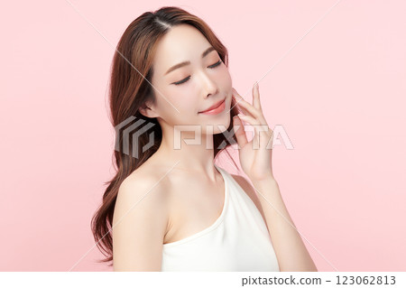 Beautiful young asian woman with clean fresh skin on pink background, Face care, Facial treatment, Cosmetology, beauty and spa, Asian women portrait. 123062813