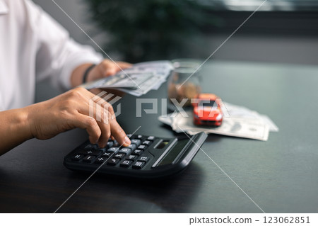 Finance bank tax expense accounting budget money businessman hand for Business expense analysis saving use car Financial calculate accountant close up calculator with graph chart write office desk Finance bank tax expense accounting budget money businessman hand for Business expense analysis saving use car Financial calculate accountant close up calculator with graph chart write office desk 123062851