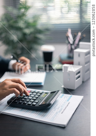 Finance bank tax expense accounting budget money businessman home for Business expense analysis saving use Financial calculate accountant close up calculator with graph chart hand write office desk Finance bank tax expense accounting budget money businessman home for Business expense analysis saving use Financial calculate accountant close up calculator with graph chart hand write office desk 123062858