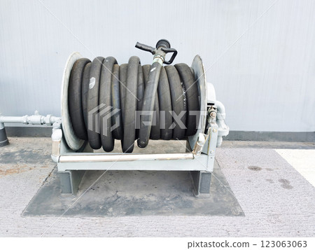 Black fire hose on a ship to prevent fire. Black fire hose on a ship to prevent fire. 123063063