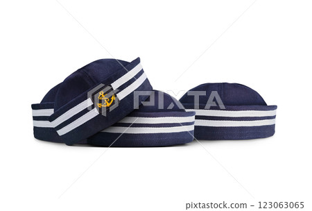A pile of navy blue hats on a white background. 123063065