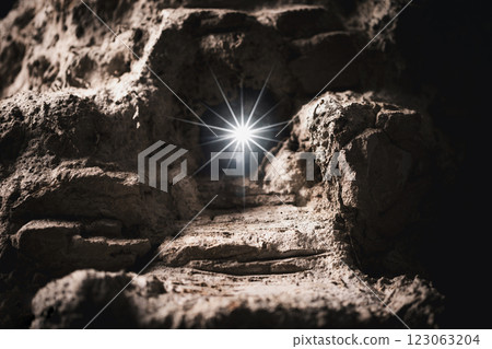 Easter resurrection concept. Jesus Christ resurrection. Empty tomb of Jesus with light. Born to Die, Rise. savior messiah redeemer gospel alive miracle. Christian religion. He is not here he is risen 123063204