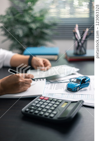 Finance bank tax expense accounting budget money businessman hand for Business expense analysis saving use car Financial calculate accountant close up calculator with graph chart write office desk Finance bank tax expense accounting budget money businessman hand for Business expense analysis saving use car Financial calculate accountant close up calculator with graph chart write office desk 123063328