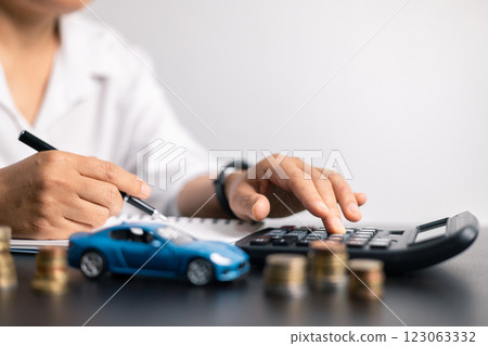 Finance bank tax expense accounting budget money businessman hand for Business expense analysis saving use car Financial calculate accountant close up calculator with graph chart write office desk 123063332
