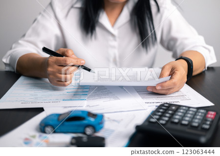 Finance bank tax expense accounting budget money businessman hand for Business expense analysis saving use car Financial calculate accountant close up calculator with graph chart write office desk Finance bank tax expense accounting budget money businessman hand for Business expense analysis saving use car Financial calculate accountant close up calculator with graph chart write office desk 123063444