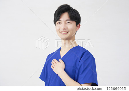 Doctor, nurse, dentist, caregiver, man with hand on chest, portrait, white background Doctor, nurse, dentist, caregiver, man with hand on chest, portrait, white background 123064035