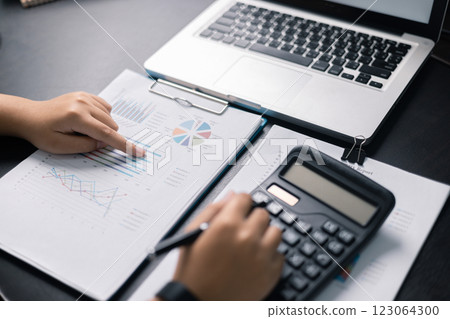 Finance bank tax expense accounting budget money businessman hand use calculator Financial calculate accountant close up calculator with graph chart write office desk Business expense analysis saving Finance bank tax expense accounting budget money businessman hand use calculator Financial calculate accountant close up calculator with graph chart write office desk Business expense analysis saving 123064300