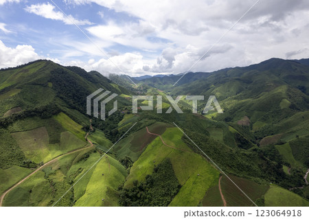 Landscape of Morning Mist with Mountain Layer. mountain ridge and clouds in rural jungle bush forest Landscape of Morning Mist with Mountain Layer. mountain ridge and clouds in rural jungle bush forest 123064918