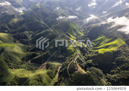 Landscape of Morning Mist with Mountain Layer. mountain ridge and clouds in rural jungle bush forest Landscape of Morning Mist with Mountain Layer. mountain ridge and clouds in rural jungle bush forest 123064929