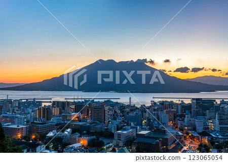 Sakurajima emitting smoke in the morning as seen from the observation deck at Shiroyama Park, Kagoshima City, Kagoshima Prefecture 123065054