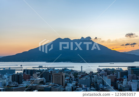 Sakurajima emitting smoke in the morning as seen from the observation deck at Shiroyama Park, Kagoshima City, Kagoshima Prefecture 123065057