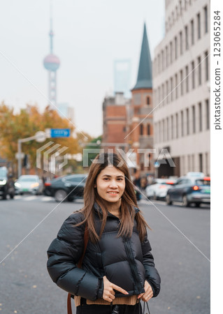 woman traveler visiting in Shanghai, China. Happy Female Tourist sightseeing Shanghai Union Church view in autumn season. landmark and popular for tourism attractions. Travel and vacation woman traveler visiting in Shanghai, China. Happy Female Tourist sightseeing Shanghai Union Church view in autumn season. landmark and popular for tourism attractions. Travel and vacation 123065284
