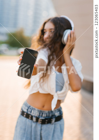 Teen Girl Showing Smartphone Screen 123065403