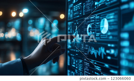 Businesswoman analyzing financial data on computer screen 123066060