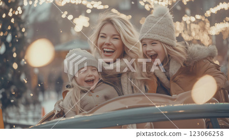 Happy family having fun riding a carousel at christmas market 123066258