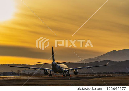 Sendai Airport at dusk, airplane taking off, Natori City, Miyagi Prefecture Sendai Airport at dusk, airplane taking off, Natori City, Miyagi Prefecture 123066377