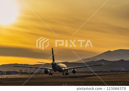 Sendai Airport at dusk, airplane taking off, Natori City, Miyagi Prefecture Sendai Airport at dusk, airplane taking off, Natori City, Miyagi Prefecture 123066378
