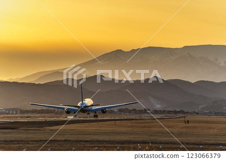Sendai Airport at dusk, airplane taking off, Natori City, Miyagi Prefecture Sendai Airport at dusk, airplane taking off, Natori City, Miyagi Prefecture 123066379