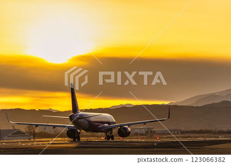 Sendai Airport at dusk, airplane taking off, Natori City, Miyagi Prefecture Sendai Airport at dusk, airplane taking off, Natori City, Miyagi Prefecture 123066382