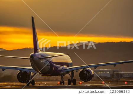 Sendai Airport at dusk, airplane taking off, Natori City, Miyagi Prefecture Sendai Airport at dusk, airplane taking off, Natori City, Miyagi Prefecture 123066383