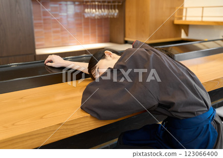 Tired restaurant employee 123066400