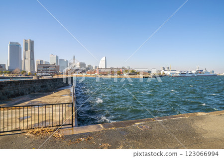 Yokohama cityscape in Japan. Strong winds (covering the city of Yokohama in dust), the sun smudges, and waves and ripples on the sea surface... = 13th 123066994