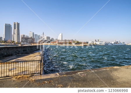 Yokohama cityscape in Japan. Strong winds (covering the city of Yokohama in dust), the sun smudges, and waves and ripples on the sea surface... = 13th Yokohama cityscape in Japan. Strong winds (covering the city of Yokohama in dust), the sun smudges, and waves and ripples on the sea surface... = 13th 123066998