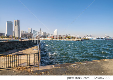 Yokohama cityscape in Japan. Strong winds (covering the city of Yokohama in dust), the sun smudges, and waves and ripples on the sea surface... = 13th Yokohama cityscape in Japan. Strong winds (covering the city of Yokohama in dust), the sun smudges, and waves and ripples on the sea surface... = 13th 123067000