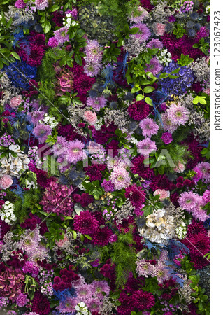 Vibrant floral wall decoration showcasing an array of colorful flowers in a lively arrangement for 123067423