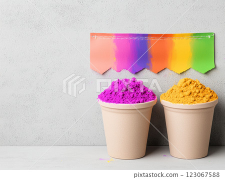 Vibrant colors of Holi powders in cups with colorful banner above 123067588