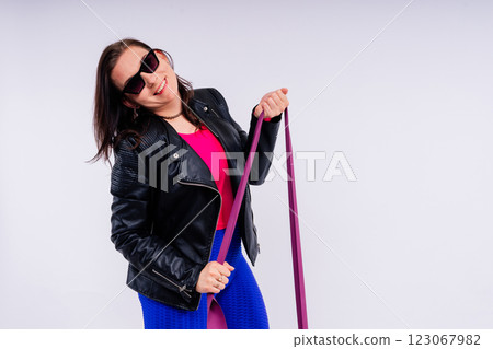 Full length photo of a young smiling fat overweight woman wearing sportswear Full length photo of a young smiling fat overweight woman wearing sportswear 123067982