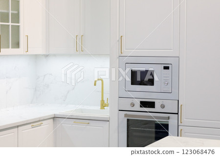 modern kitchen interior with white cabinets modern kitchen interior with white cabinets 123068476