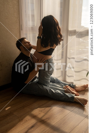 Intimate Moment of Expecting Parents by the Window Intimate Moment of Expecting Parents by the Window 123069800
