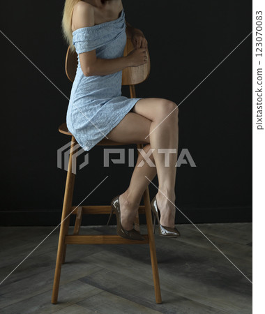 portrait of a young woman in a blue dress, full growth portrait of a young woman in a blue dress, full growth 123070083