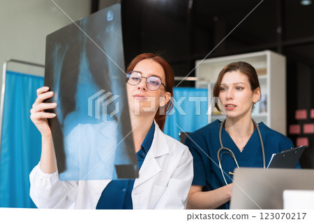 Medical Team Using Digital Tablet for Healthcare, Doctor Technology, X-Ray Analysis. Medical Team Using Digital Tablet for Healthcare, Doctor Technology, X-Ray Analysis. 123070217