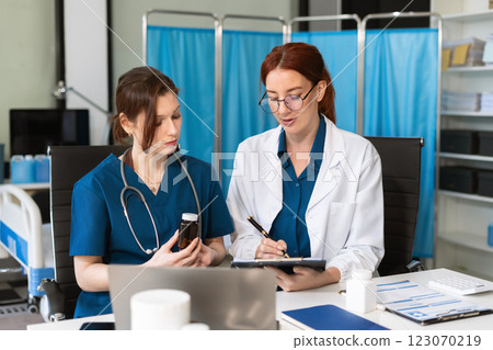 Diversity, medical team head leaders discuss results, brainstorming and planning. 123070219